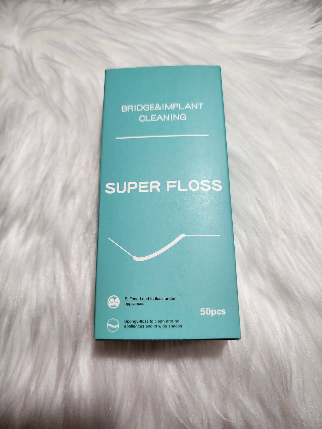 Box of Super Floss dental floss 