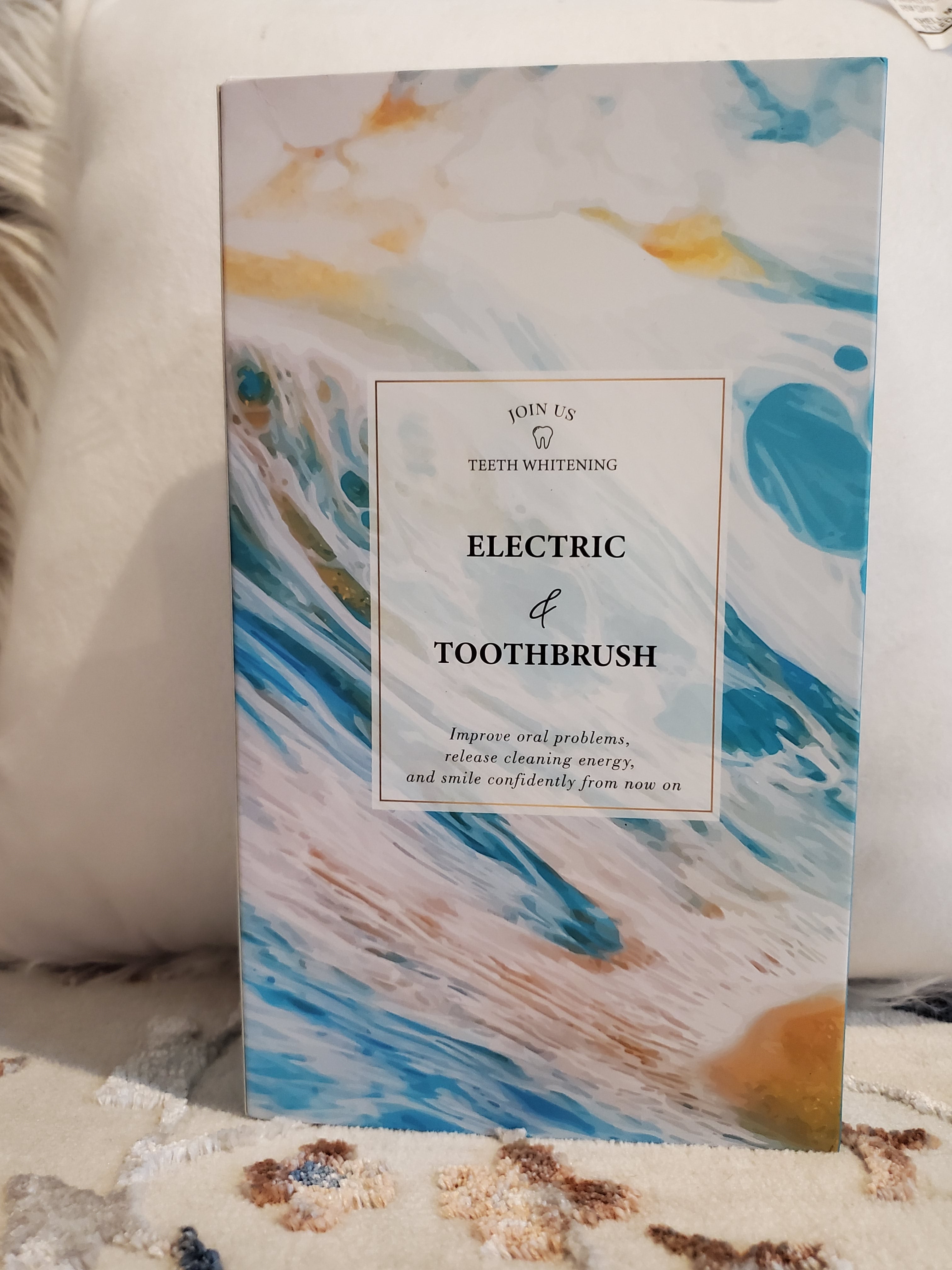 Product packaging with abstract design and text on a textured surface