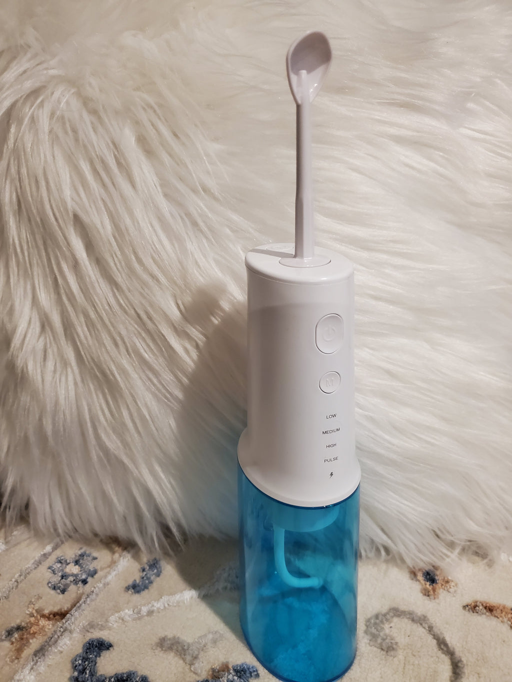 Blue and white dental flosser 
